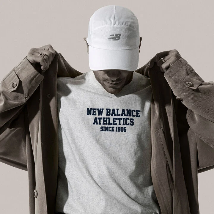 Close up of man wearing NB apparel and accessories 