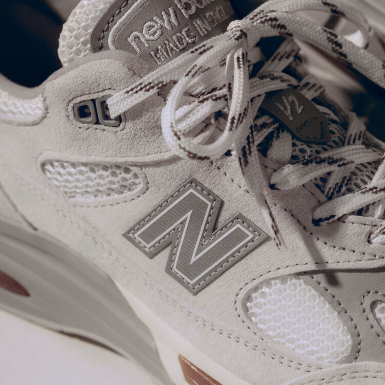 A close-up detailed view of a pair of New Balance Made in UK sneakers. 