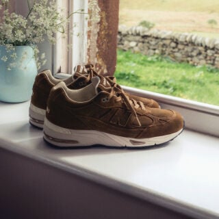 Close up view of a New Balance Made in UK sneaker tongue and laces.  